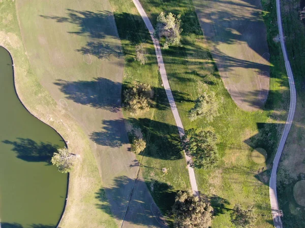 Aerial top view of golf course with green field