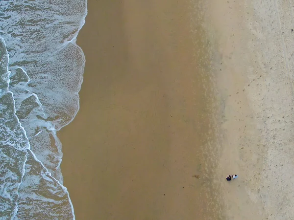 Aerial top view of the ocean waves washing on the coast of the Pacific ocean — 스톡 사진
