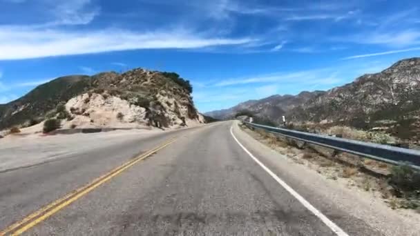 Road trip in Angeles National forests mountain with blue sky, California, USA. — Stock Video