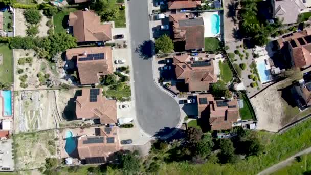 Aerial view of upper middle class neighborhood in the valley with blue sky — Stock Video