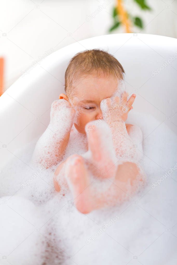 Baby taking a bubble bath