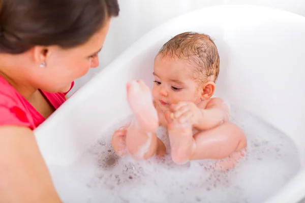 Baby in bath with bubbles — Stock Photo, Image