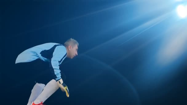 Football soccer goalkeeper jumping on black background — Stock Video