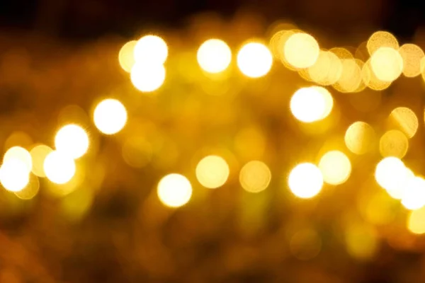 Holidays, luxury and background concept, blurred golden christmas lights bokeh. — Stock Photo, Image