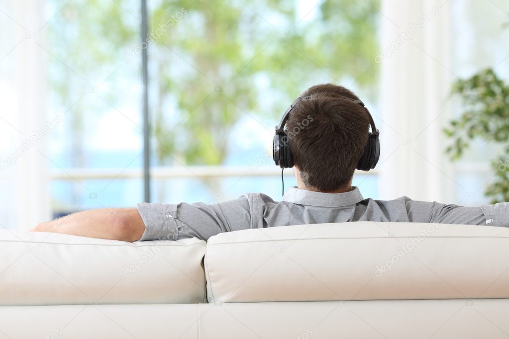 Man relaxing and listening music