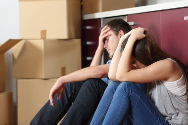 Sad evicted couple worried moving house clipart
