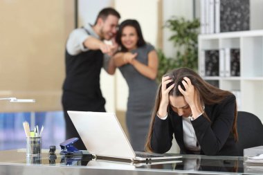 Businesspeople bullying a colleague at office clipart