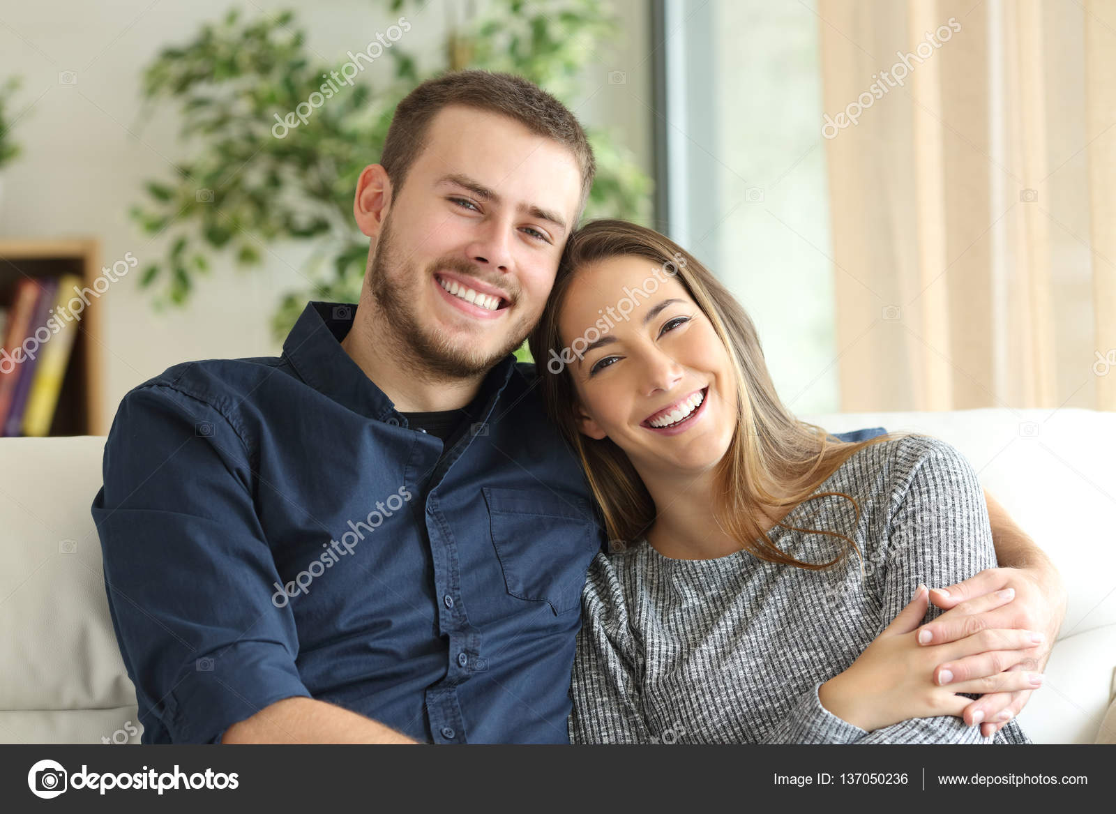 Premium Photo | Portrait of happy beautiful young couple posing at kitchen