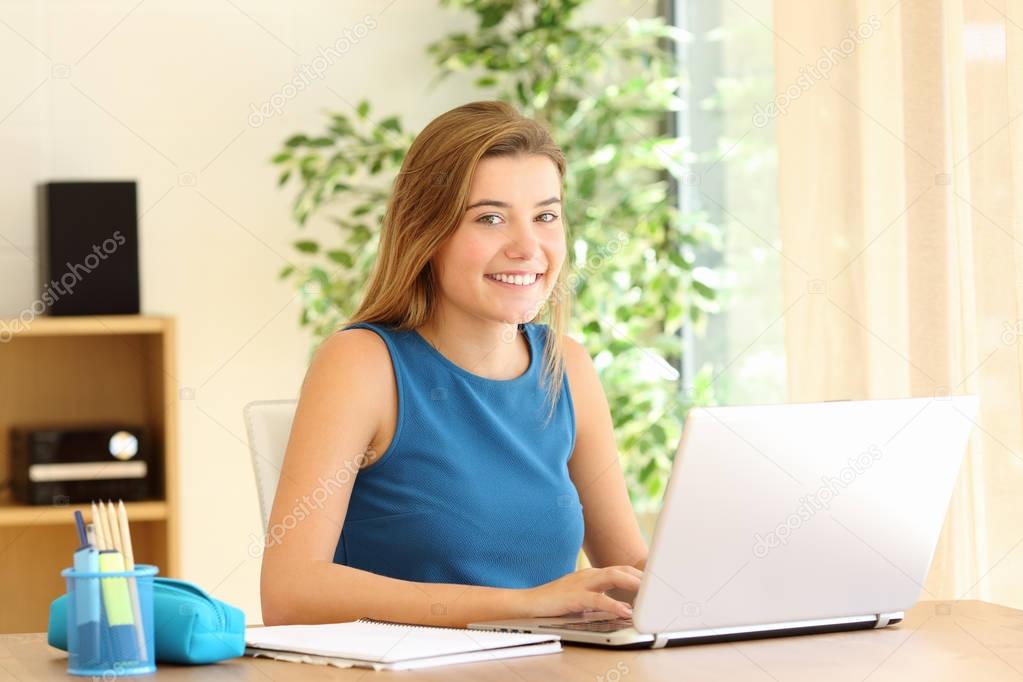 Confident student posing while doing homework