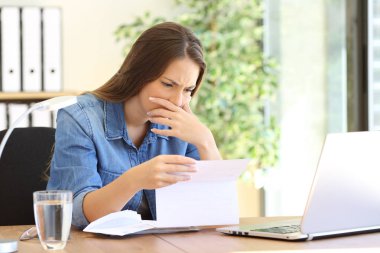 Worried entrepreneur girl reading a letter clipart