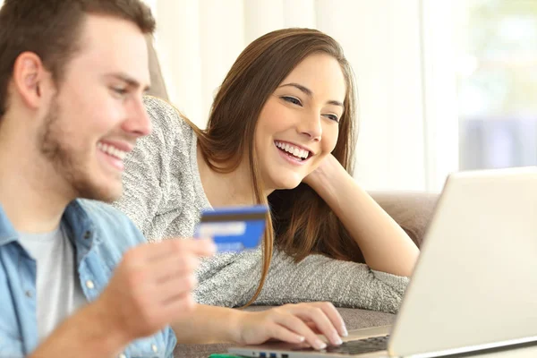 Couple buying online on a couch