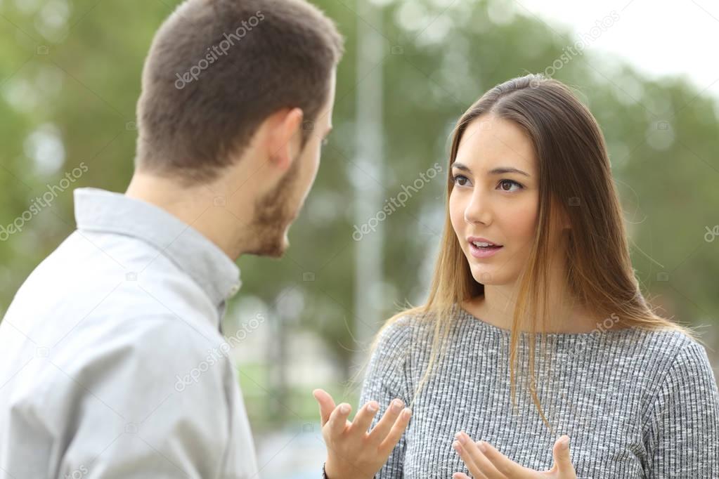 Couple talking outdoors in a park