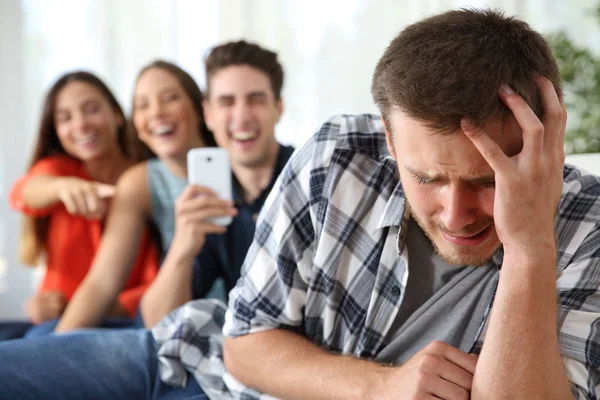 Friends bullying to a sad boy — Stock Photo, Image
