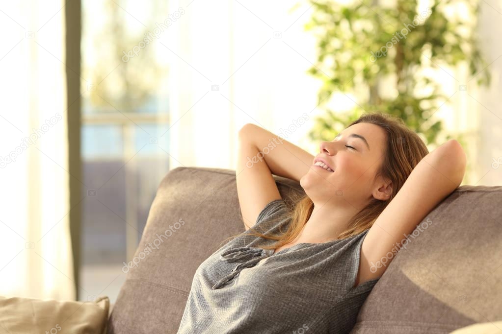 Girl relaxing on a sofa at home