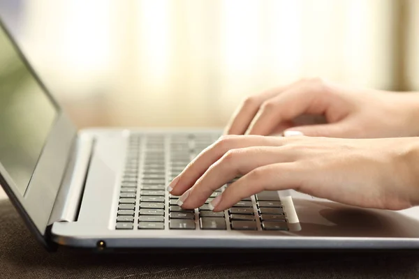 Woman hands typing on a laptop keyboard — Stock Photo, Image