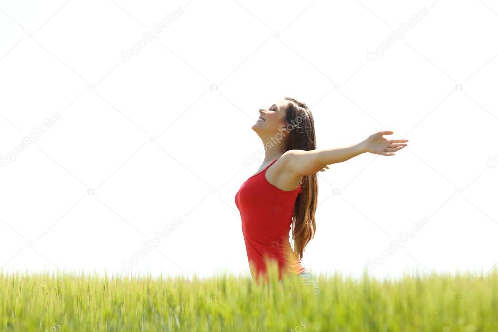 Profile of a girl breathing fresh air in a field