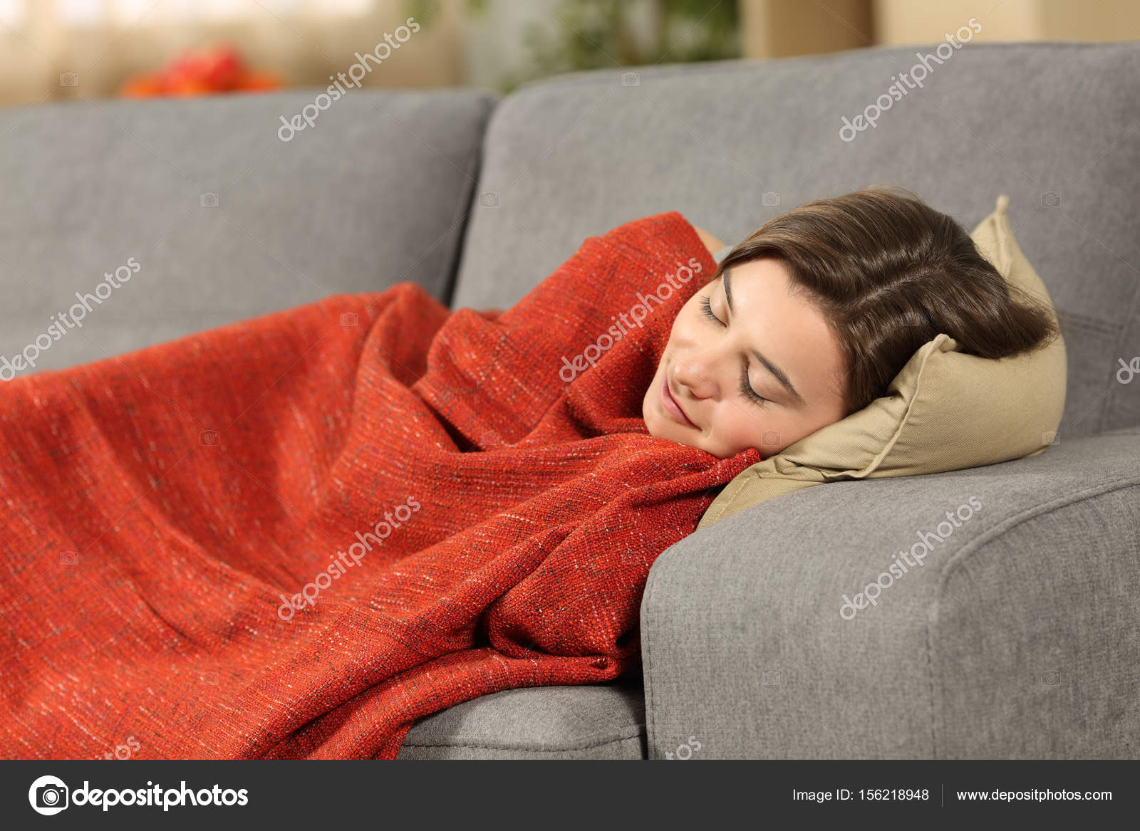Girl sleeping on a couch at home — Stock Photo © AntonioGuillemF 156218948