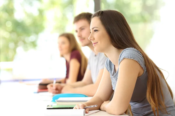 Students listening lesson in a classroom — Stock Photo, Image