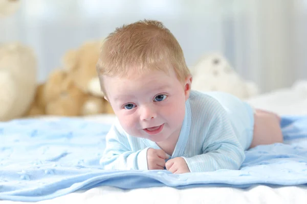 Baby on a blue blanket — Stock Photo, Image
