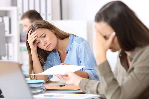 Two worried employees receiving bad news — Stock Photo, Image