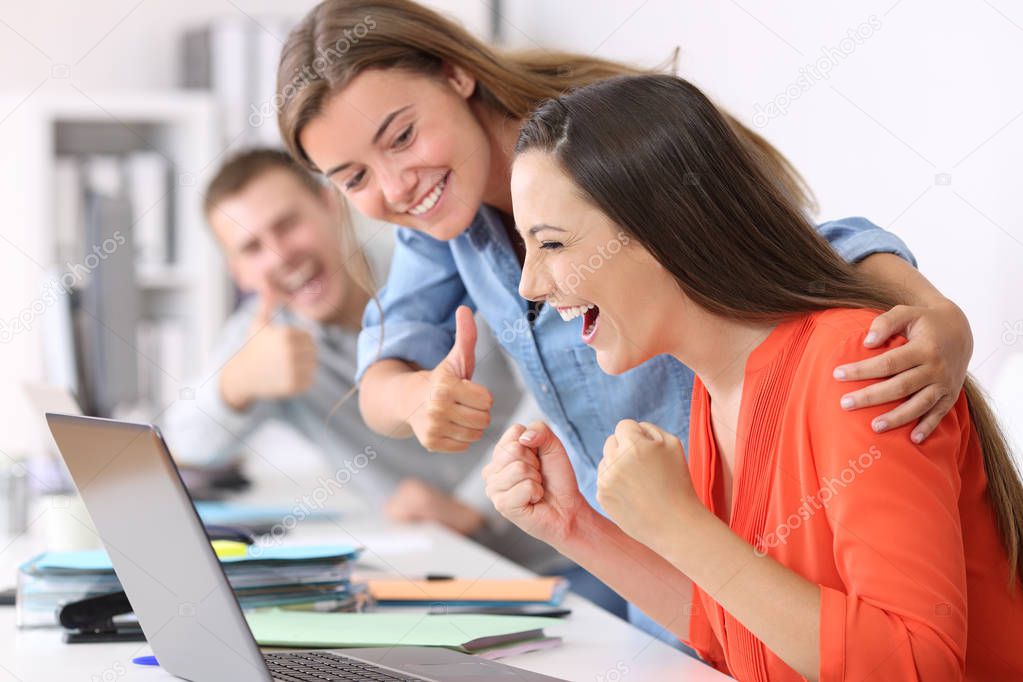 Employee being congratulated by colleagues