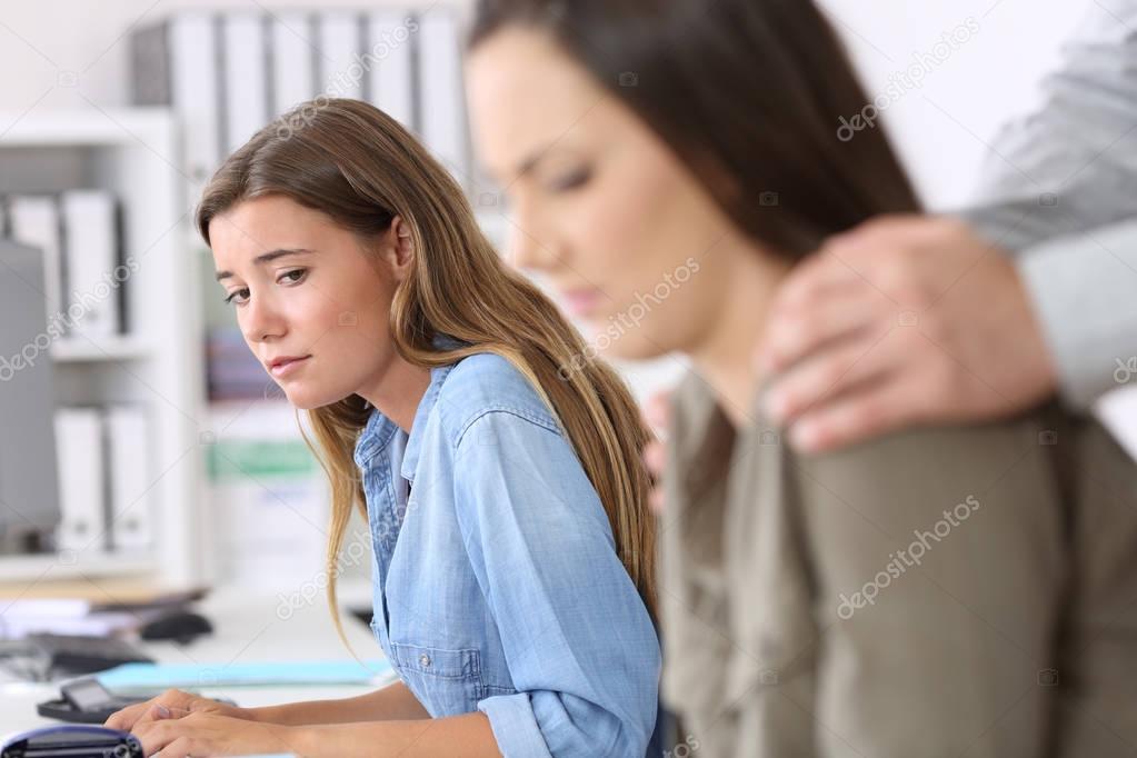 Employee being victim of harassment and colleague watching