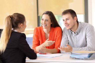 Happy customers talking with office worker clipart