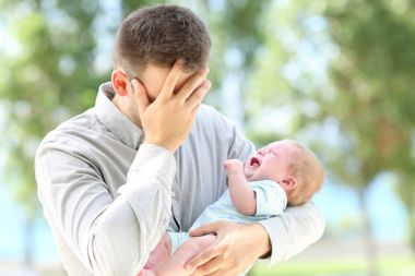 Worried father and baby crying clipart