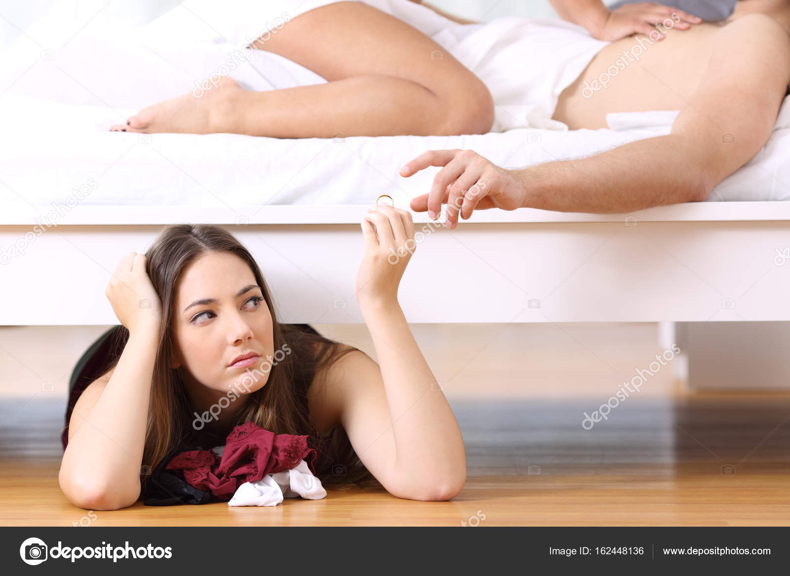 Lover hidden while man is having sex with his wife Stock Photo by ©AntonioGuillemF 162448136 picture