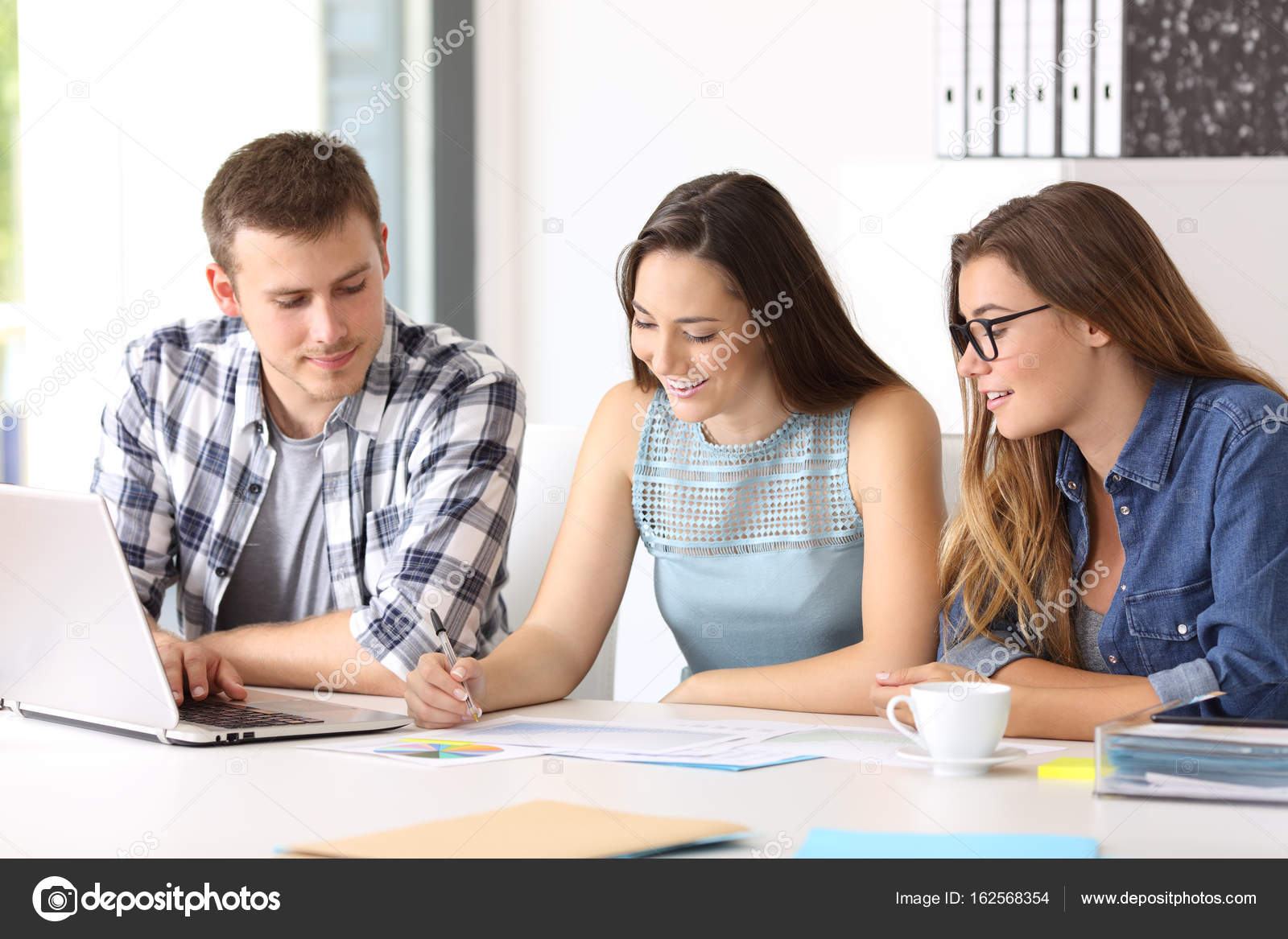 Three employees coworking at office — Stock Photo © AntonioGuillemF