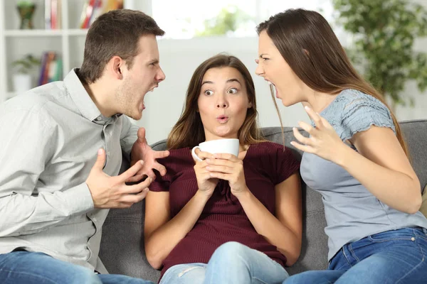 Friend in the middle of a couple argument — Stock Photo, Image