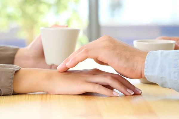 Man touching the hand of his partner during a date — Stock Photo, Image