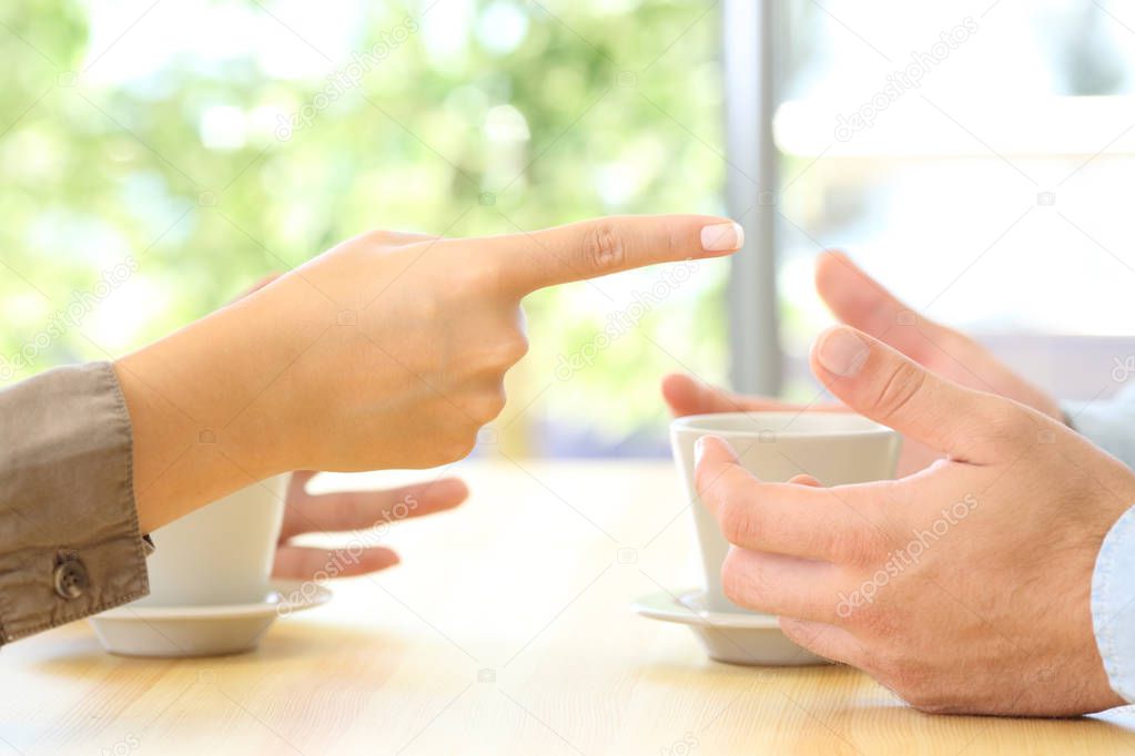 Close up of couple hands arguing at home