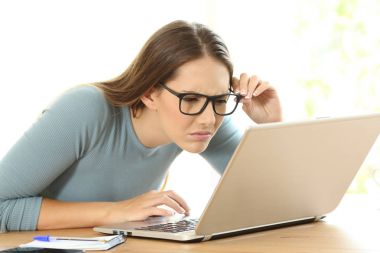 Woman with eyesight problems trying to read clipart