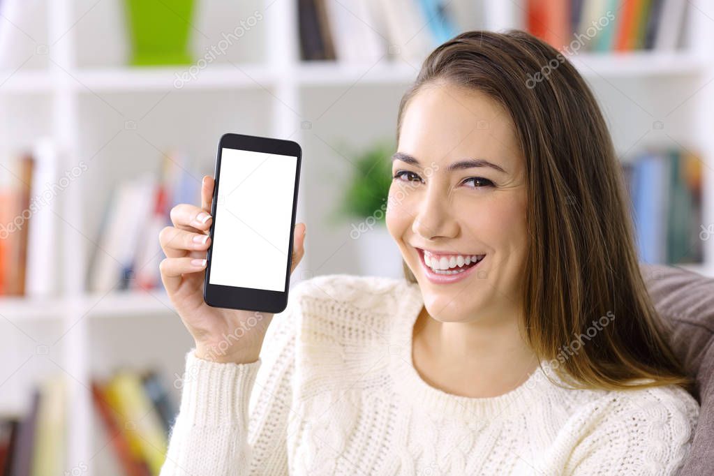 Happy woman showing smart phone screen