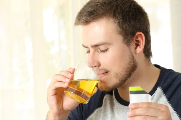 Man drinking a medicine — Stock Photo, Image