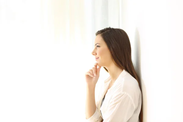 Profile of a woman thinking at home on white — Stock Photo, Image