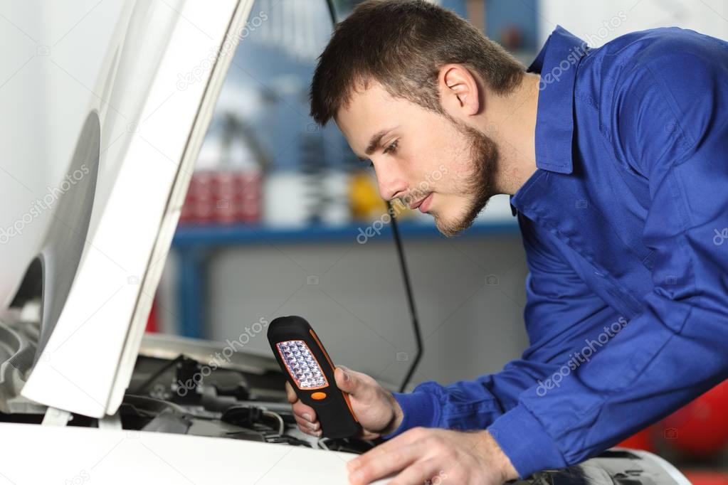 Car mechanic checking for failure