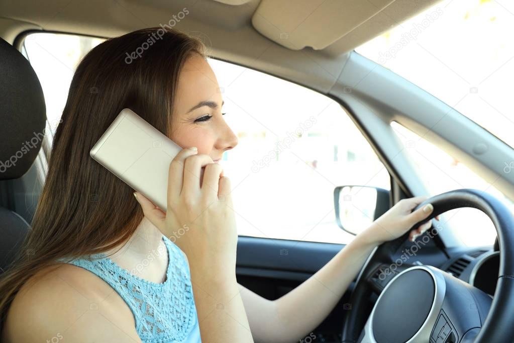 Distracted driver calling on phone driving a car