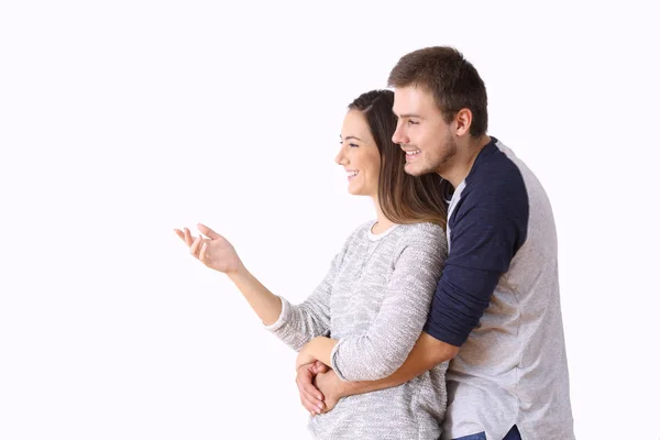 Couple presenting a blank space on white background — Stock Photo, Image
