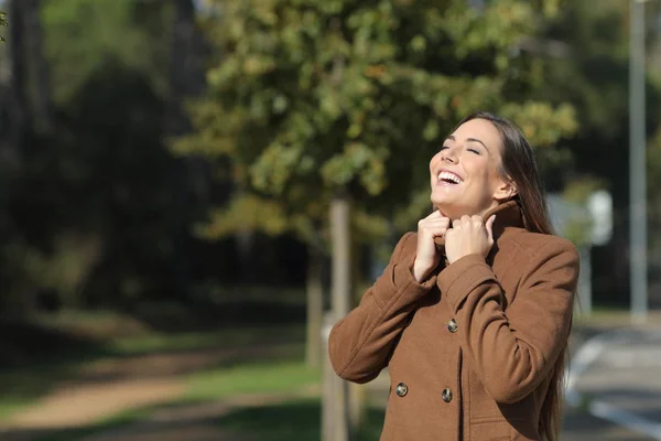 Happy woman warmly clothed in winter breathing fresh air — Stock Photo, Image