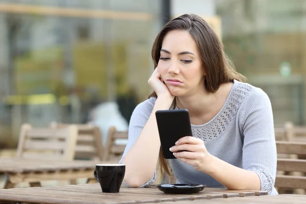 Bored Girl Looking Disappointed Her Smart Phone Cafe Terrace — Stock Photo, Image