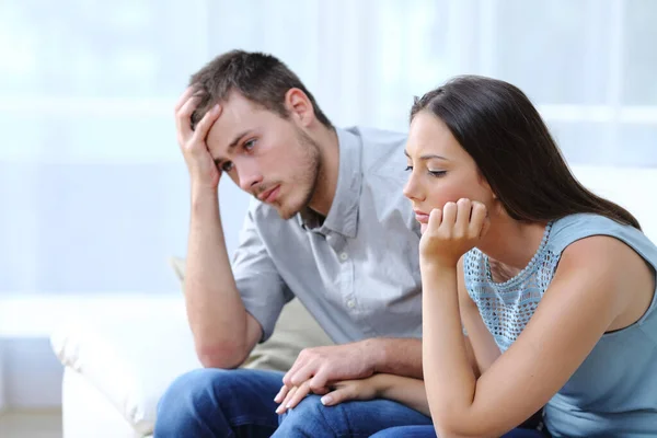 Sad Worried Couple Complaining Together Holding Hands Couch Home — Stock Photo, Image
