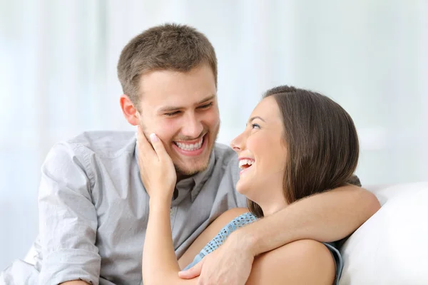 Happy Young Couple Laughing Flirting Sitting Sofa Home — Stock Photo, Image