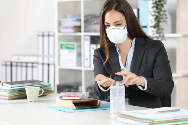 Executive cleaning hands after open a package avoiding coronavirus contagion at office