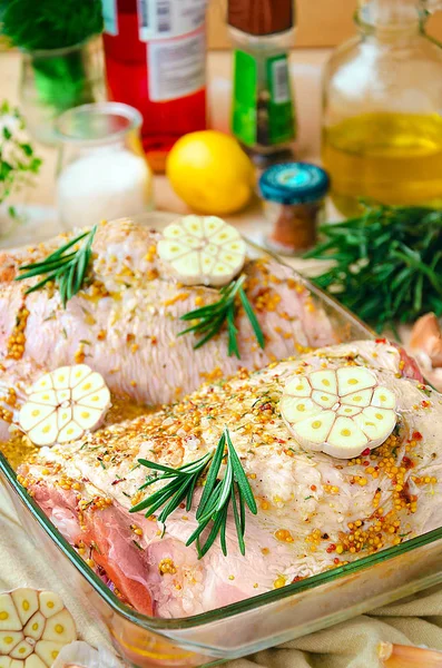 Raw marinated turkey thighs with mustard, spices, rosemary and garlic, ready to be roasted — Stock Photo, Image