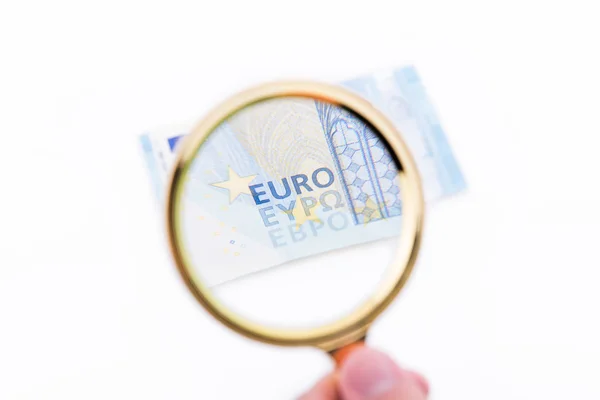 Magnifying glass with tewnty euros — Stock Photo, Image