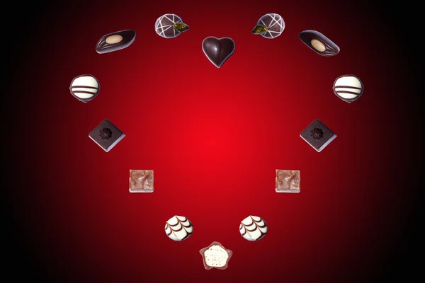 Coração Chocolates Sobre Fundo Vermelho — Fotografia de Stock