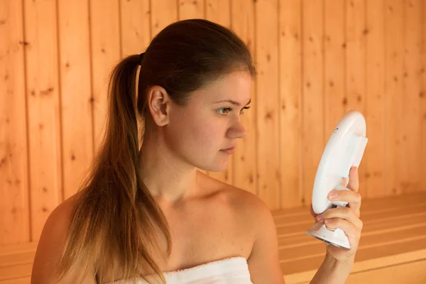 young woman in sauna