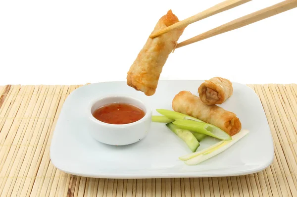 Spring rolls in chopsticks